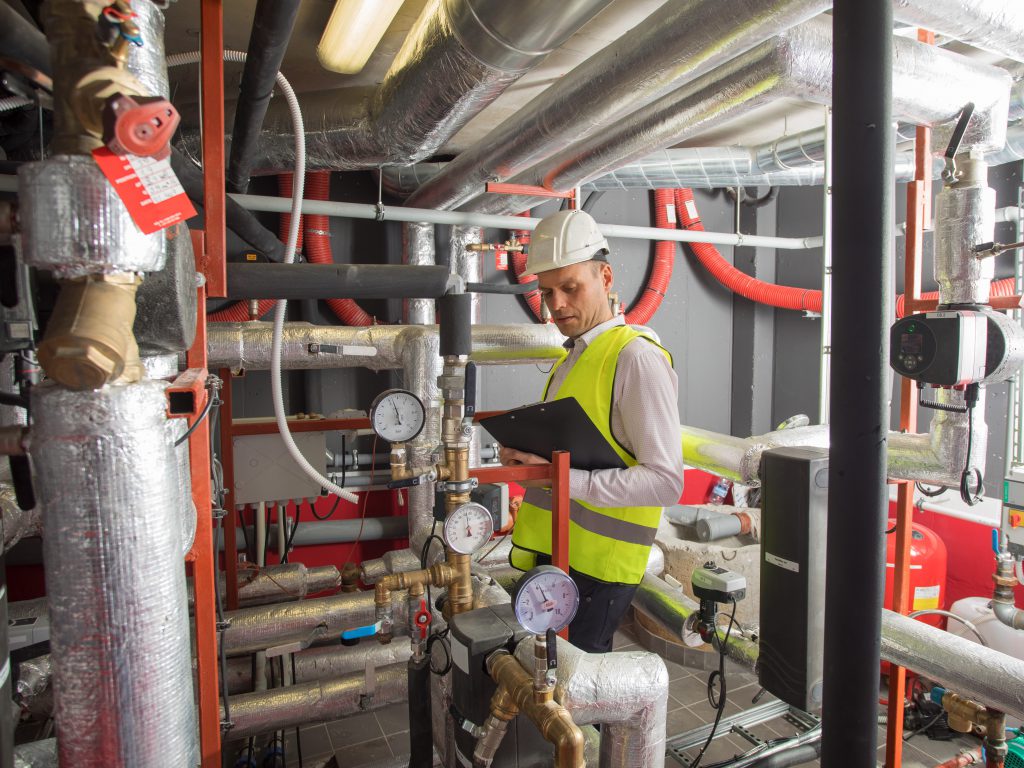 Photo of contractor in boiler room